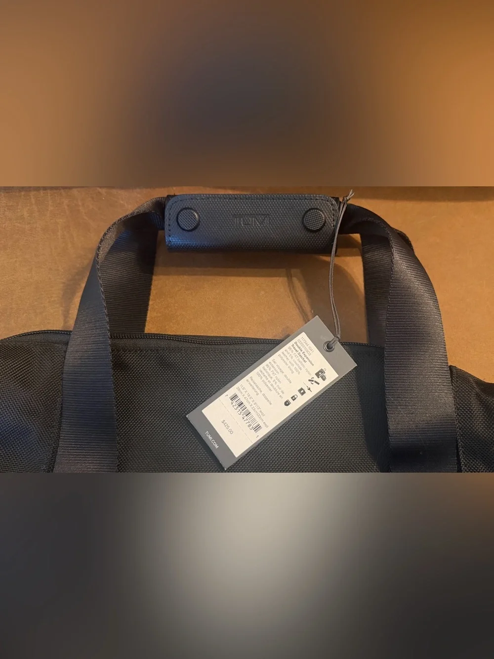 Tumi impressive 13
